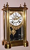 Ansonia Clock Co., Ansonia, Conn. "SYMBOL EXTRA" model crystal regulator 8 day time and unusual strike on dual bells spring driven mvt in rolled brass case with Roman numeral chapter ring and exposed escapement, c1894
