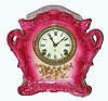 Ansonia Clock Co., Porcelain china clock, C.1900, standard line "WAG", in a darker pink color with floral decorations, restored.
