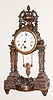 French, Farcot, Swinging Doll novelty timepiece, in a patinated spelter case, C.1890, doll or cherub "pendulum" swings from front to back.