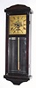Gilbert Clock Co., miniature "Hollywood" wall timepiece in a mahogany stained poplar case, and with beveled glass in lower door.
