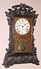 Seth Thomas Clock Co., rare "SANTA FE", city series walnut mantel clock, complete with all its metal leaves and damascene pendulum, 8-day with cathedral gong strike and lighter walnut dial surround.