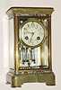 French, brass and glass 'Crystal' regulator, with green onyx top and base, and with bands bearing enamel inlay both top and bottom, and with a 2-vial compensating pendulum (intact).