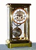J. Marti and Cie., for Guilmet, crystal regulator 8 day time and strike, with a form of Desfontaines escapement exposed on the dial center, patented 1854, with sweep second's hand, Roman numeral porcelain chapter ring and compound pendulum, c1885. This type of modified Desfontaines escapement is a form of coup perdu (lost beat) escapement that allows for a sweep second's hand to indicate true seconds from a half second's beating pendulum, with the added advantage of constant force impulsing the pendulum