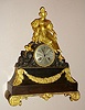 French gilded brass figural mantel clock time and strike silk thread suspension spring driven movement with gilded lady petting her dog seated atop bronze base decorated with gilded trim on gilded brass feet with engine turned silvered 3" dial and Breguet style moon hands, c1840, mvt marked with an "M" and "4976"