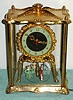 UNITED CLOCK CO.: Brooklyn, N.Y., 379 De Kalb Ave., C.1940. Model 990, 4-glass "regulator" with little plastic dancers in French attire, dancing around in a circle. 110v, w/ original cord