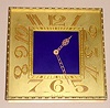 Swiss 8 day spring driven Art Deco desk clock in square gilt frame with blue enamel center, c1920, No. 81 on case
