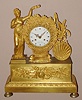 French, Leroy a'Paris, C.1840, Ormolu figural clock depicting the goddess of Harvest placing a crown on a bushel of wheat, with a grain basket standing on the right side. With a bell strike movement with silk thread suspension.