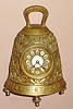French for Maple and Co., London [on dial], miniature bell timepiece, cast of heavy brass, showing in relief several Christian tenants, and with cast angels all around, each playing a different musical instrument. This is the smallest version of the "Pater Noster" clock, note there is a porcelain china one selling in earlier session.