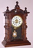 Welch, Spring and Co., C.1878, PATTI model mantel clock, rosewood case with gold highlighted front glass, nicely cleaned.