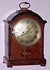English /Scottish, Regency bracket clock, 2-fusee, time and strike in a mahogany case with inlay to the front panel, 8-day, with cathedral gong strike, and with 7 inch silvered dial bearing name of retailer Edward, Glasgow.