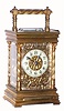 French, brass cased time, strike and repeat carriage clock, in an attractive case with candy twist columns and handle, and with a lovely floral mask surrounding the porcelain dial, c.1900
