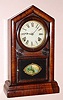 E. N. Welch, Forestville, Conn, an uncommon "Italian" style gothic clock; seems to have the outer dimensions of a Peerless, but the door of an Italian; we do not find this model in the Welch catalog, however it has a very good label is definitely orginal as shown.
