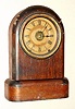 Seth Thomas, Thomaston, Conn. "TUDOR NO. 1" time, strike and alarm 8 day sprind driven movement in mahogany veneered case with Roman numeral papered dial, c1879