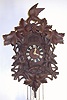 German, Valentine Flieg, larger cuckoo and quail, 3-wt quarter strike Wolf and Grape black forest wall clock, C.1925