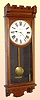 New Haven Clock Co., C.1885, "Standard Time No. 9", walnut cased weight regulator, 8-day time, case style with Eastlake influence.