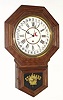 Wm. L. Gilbert Clock Co., 12" Octagon Drop, model No. 3027, timepiece with calendar, in oak. This model wtih simpler molding replaced the Admiral model around 1915. 8-day duration.