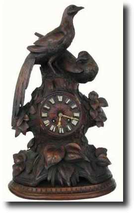 C.1875, Black Forest Carved Figural clock — Antique Clocks Price Guide