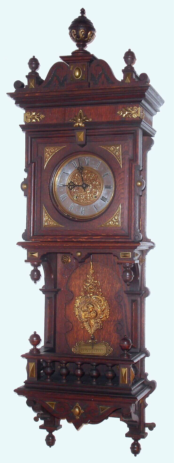 German, Lenzkirch, uncommon long wall clock with open style showing the pendulum in full view and the case with bronze trimmings, and fancy cast pendulum, c1880, serial #739569 — Antique Clocks Price Guide
