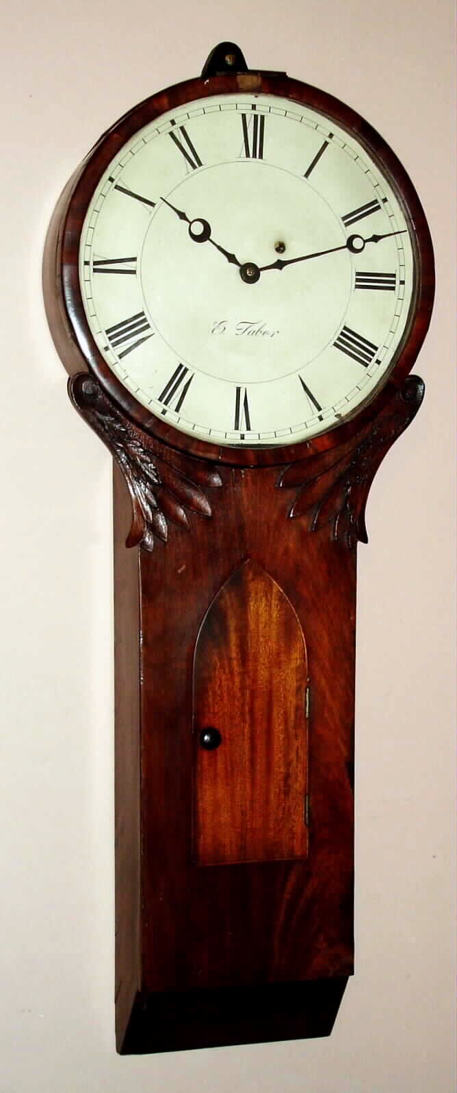 E. Taber, Roxbury style tavern clock in a mahogany case with carved accents below the dial, with a later time only weight movement, c.1810 — Antique Clocks Price Guide