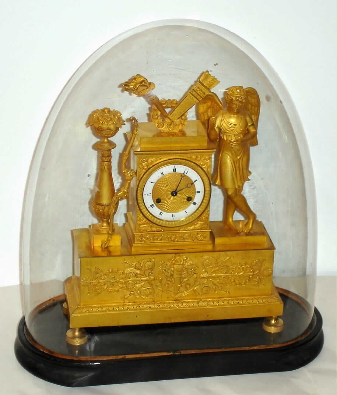 French Empire, ormolu figural mantel clock 8 day time and strike mvt with silk thread suspension on a wooden base with period glass dome, c1830 — Antique Clocks Price Guide