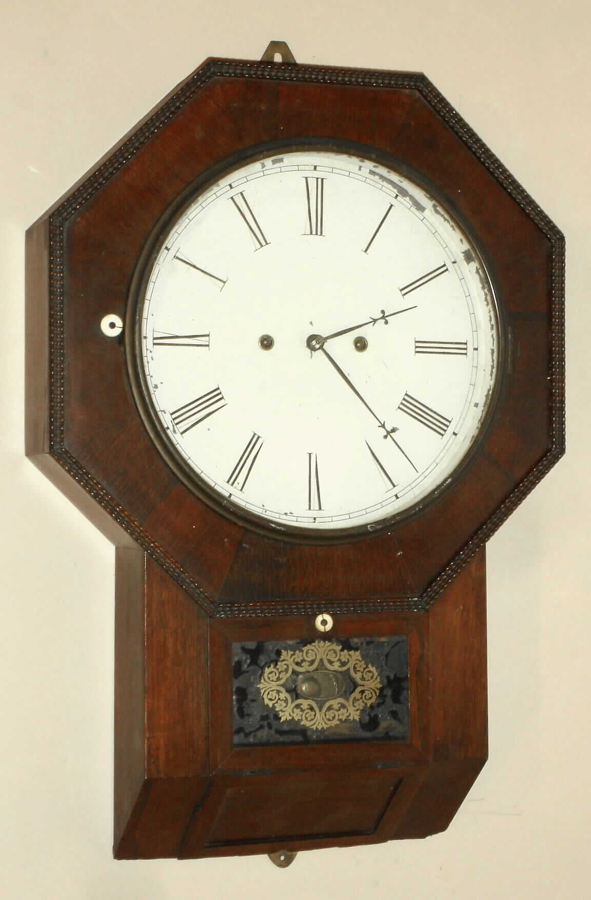 Atkins Clock Co., Octagon Drop, XX Regulator with type III (fancy frame) Wagon Spring movement, 30-day, in a rosewood veneered case with ripple molding around the top, C.1859. Movement designed by Joseph Ives. — Antique Clocks Price Guide