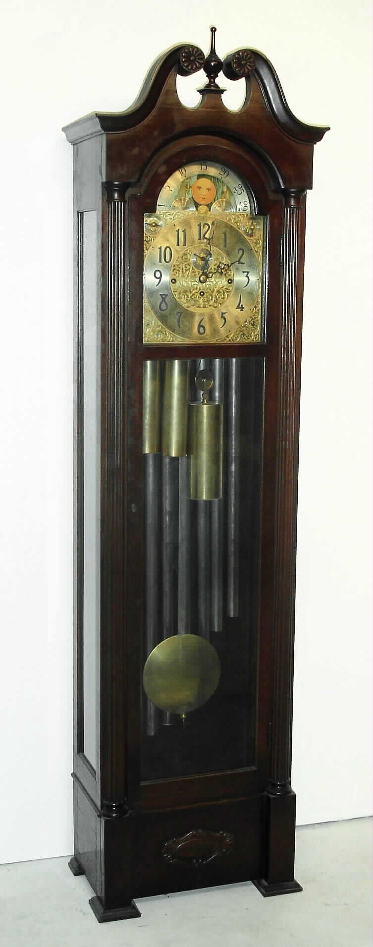 Herschede Clock Co. Cincinnati, Ohio, Model 217 triple tune, rolling moon tall case clock time and quarter chime on 9 tubes with option for Westminster, Whittington, or Canterbury chimes and silent lever, in a mahogany case with fluted half columns and steel and pierced brass moon phase dial, c1950 — Antique Clocks Price Guide