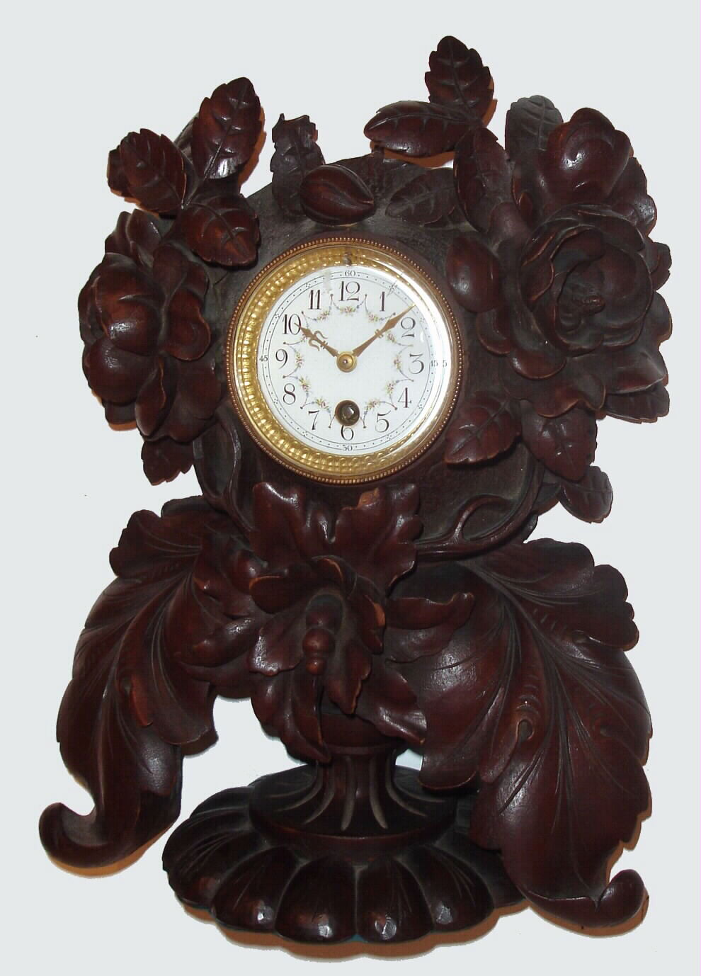 Swiss, Black Forest style carved mantel clock from Interlaken area, with French 8-day time-only movement, C.1890. — Antique Clocks Price Guide