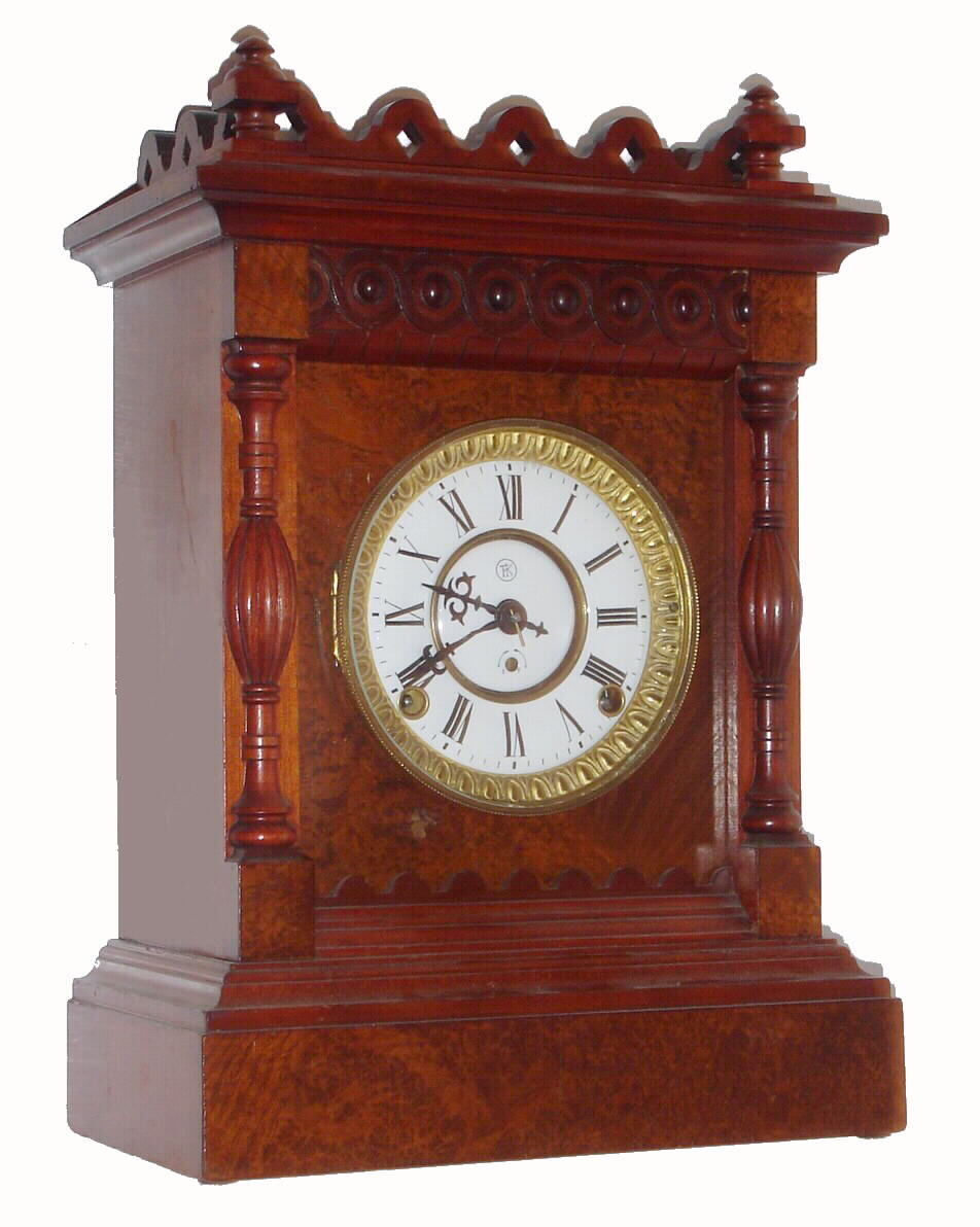 F. Kroeber Clock Co., New York, "Modena" 8 day time and strike spring driven Eclipse movement in walnut case burled front with porcelain dial, c1890 — Antique Clocks Price Guide