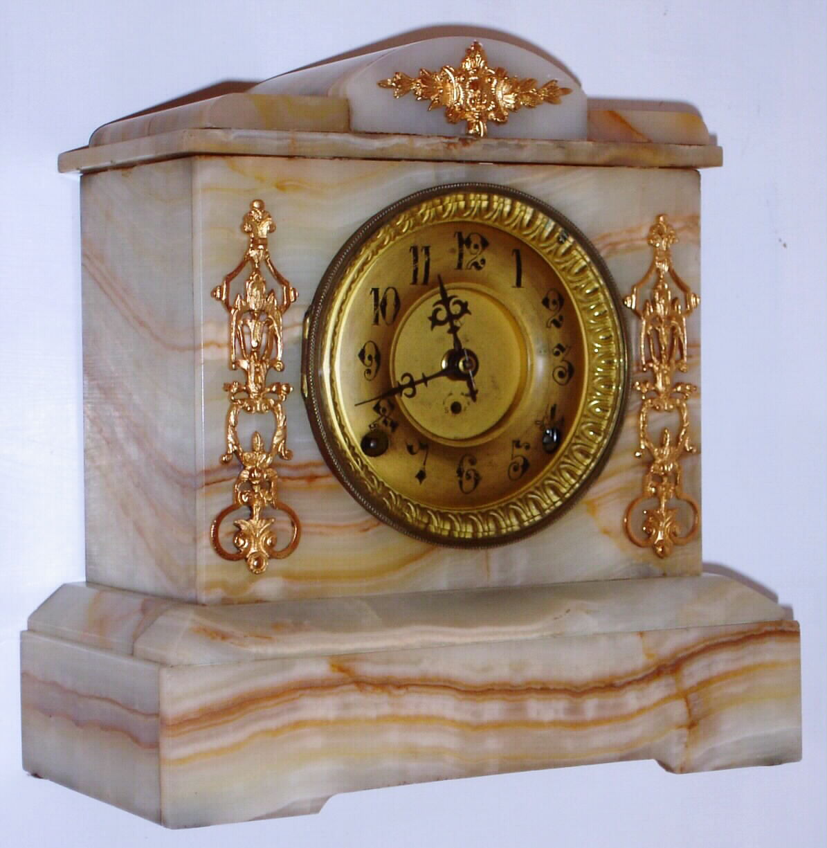 F. Kroeber Clock Co., New York striated onyx case mantel clock with 8 day time and strike spring driven Asian No. 1 movement with fancy embossed back plate, c1900 — Antique Clocks Price Guide