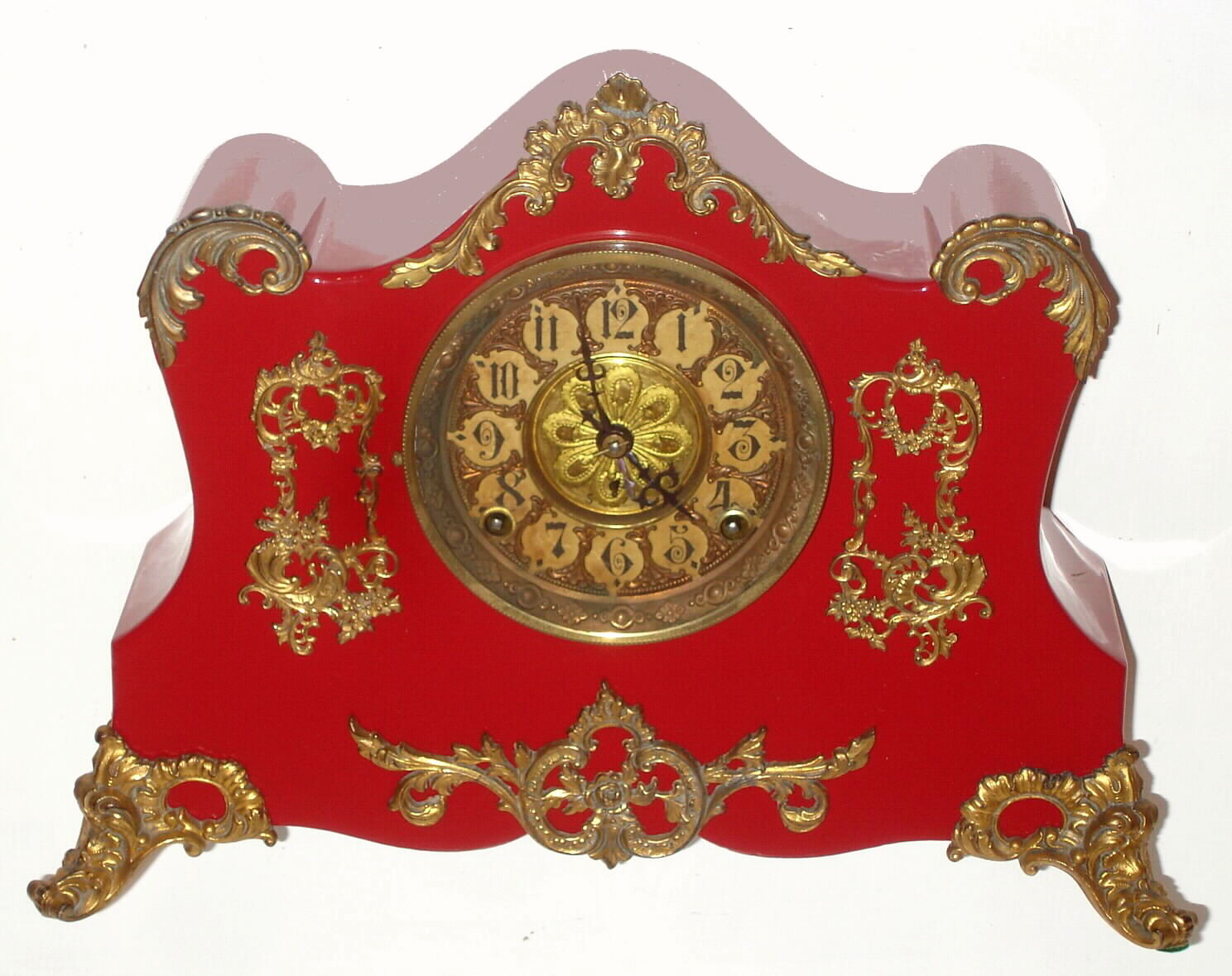 F. Kroeber Clock Co., New York "Richelieu" 8 day time and strike spring driven Eclipse movement in red enamel cast iron case, c1895 — Antique Clocks Price Guide