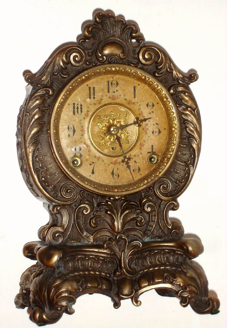 F. Kroeber Clock Co., New York bronze finished mantel clock 8 day time and strike spring Eclipse movement, c1900 — Antique Clocks Price Guide