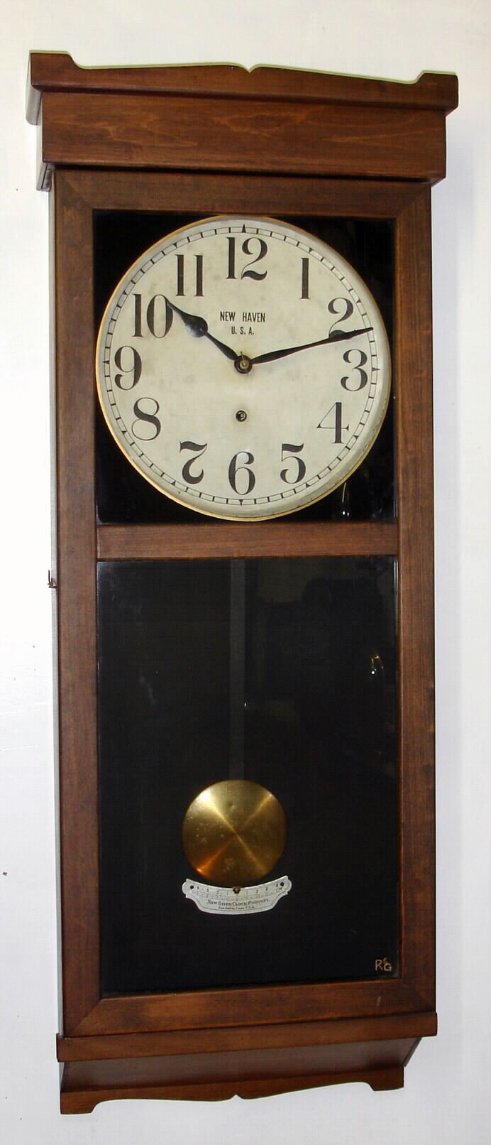 New Haven Clock Co., Conn., "No. 3043" 8-day time-only stained wood wall clock, C.1917. — Antique Clocks Price Guide