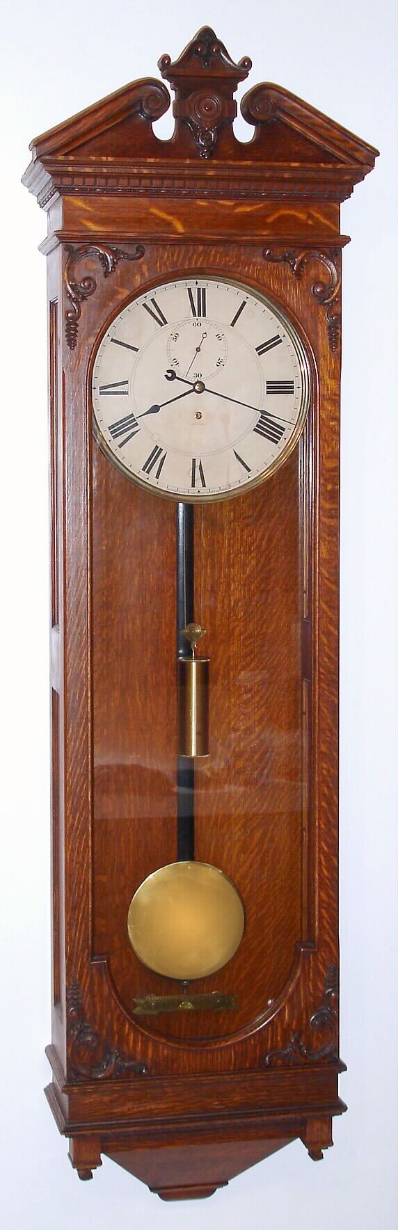 Seth Thomas, Thomaston, Conn., "Regulator No. 63" wall clock 8 day time only weight driven movement with second's beating Graham deadbeat escapement in oak case, c1886 — Antique Clocks Price Guide