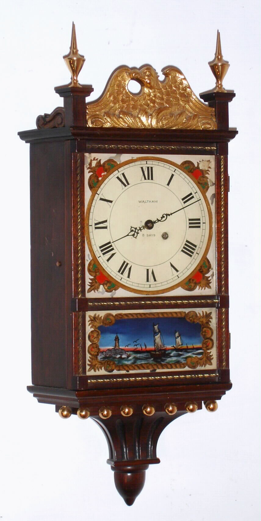 Waltham Clock Co., Waltham, Mass., "No. 1470" miniature colonial-style wall clock 8 day time only key wind spring driven 7 jewel movement in mahogany rope front case with reverse painted tablets, c1930 — Antique Clocks Price Guide