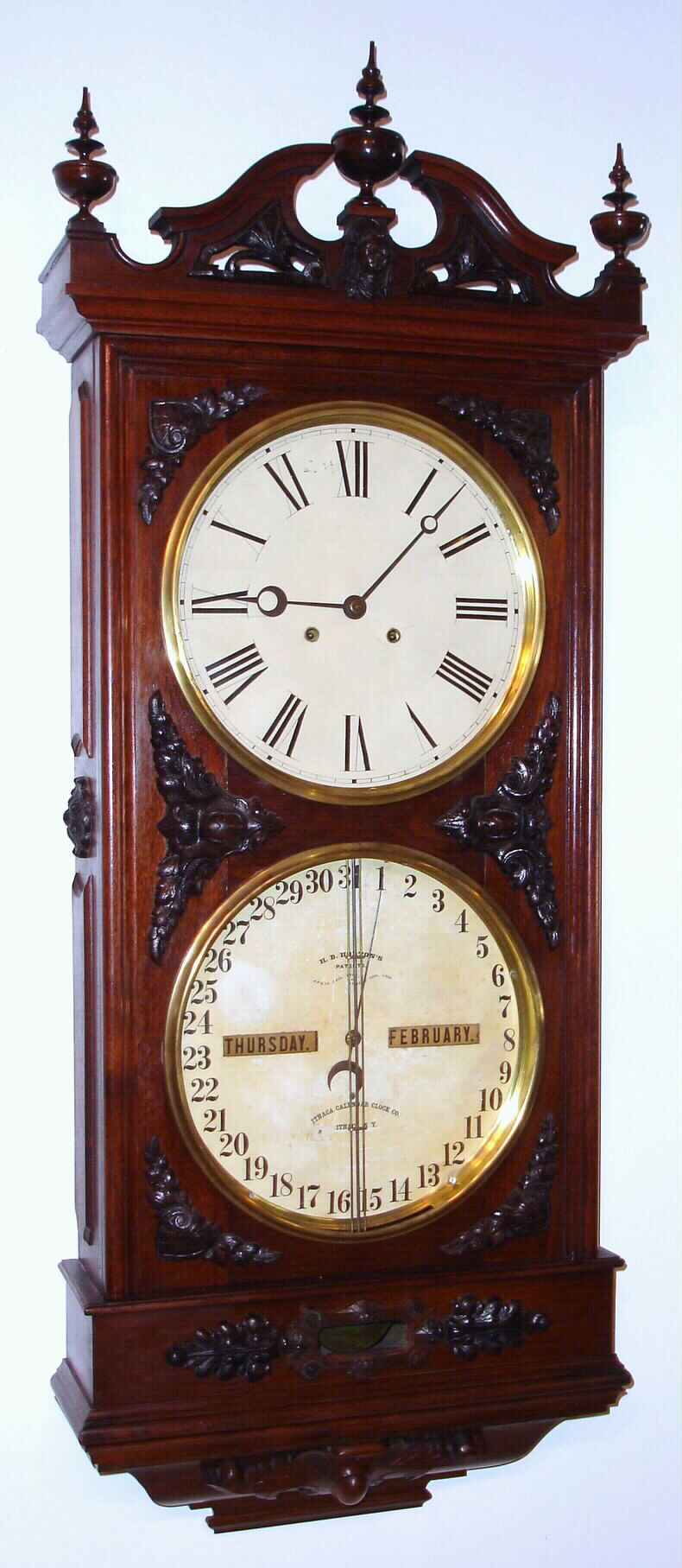 Ithaca Calendar Clock Co., Ithaca, New York, "Regulator No. 1" or "Hanging Bank Clock" double dial calendar wall clock 8 day time only two weight movement with perpetual calendar in walnut case, c1875 — Antique Clocks Price Guide