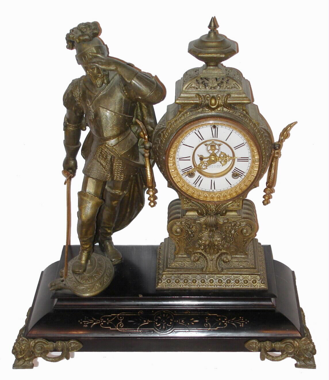 Ansonia Clock Co., Ansonia, Conn., "Pizzaro" figural mantel clock with 8 day time and gong strike movement, with open escapement on the porcelain dial, all mounted to an enameled iron base with spelter statue, c1895 — Antique Clocks Price Guide