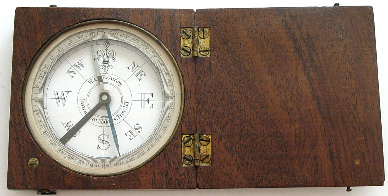 W. and L.E. Gurley, Troy, N.Y. Instrument Makers pocket compass with silvered graduated ring and paper dial in mahogany box, c1880 — Antique Clocks Price Guide