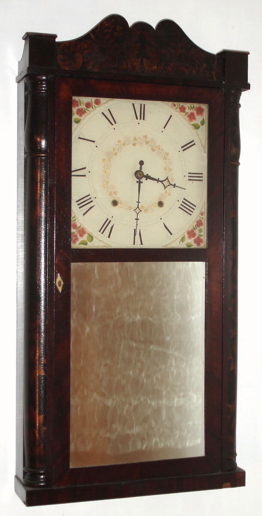 Seth Thomas, Plymouth, Conn., C. 1828 30-hour wood movement quarter column and splat shelf clock. Short pendulum movement with an early style label. Note S. Thomas produced this early long case with arched splat under full influence of the pillar and scroll, and this must be the earliest long case stenciled column he made, certainly pre-1830, and it is correct with short movement. From the collection of Chris Bailey. — Antique Clocks Price Guide