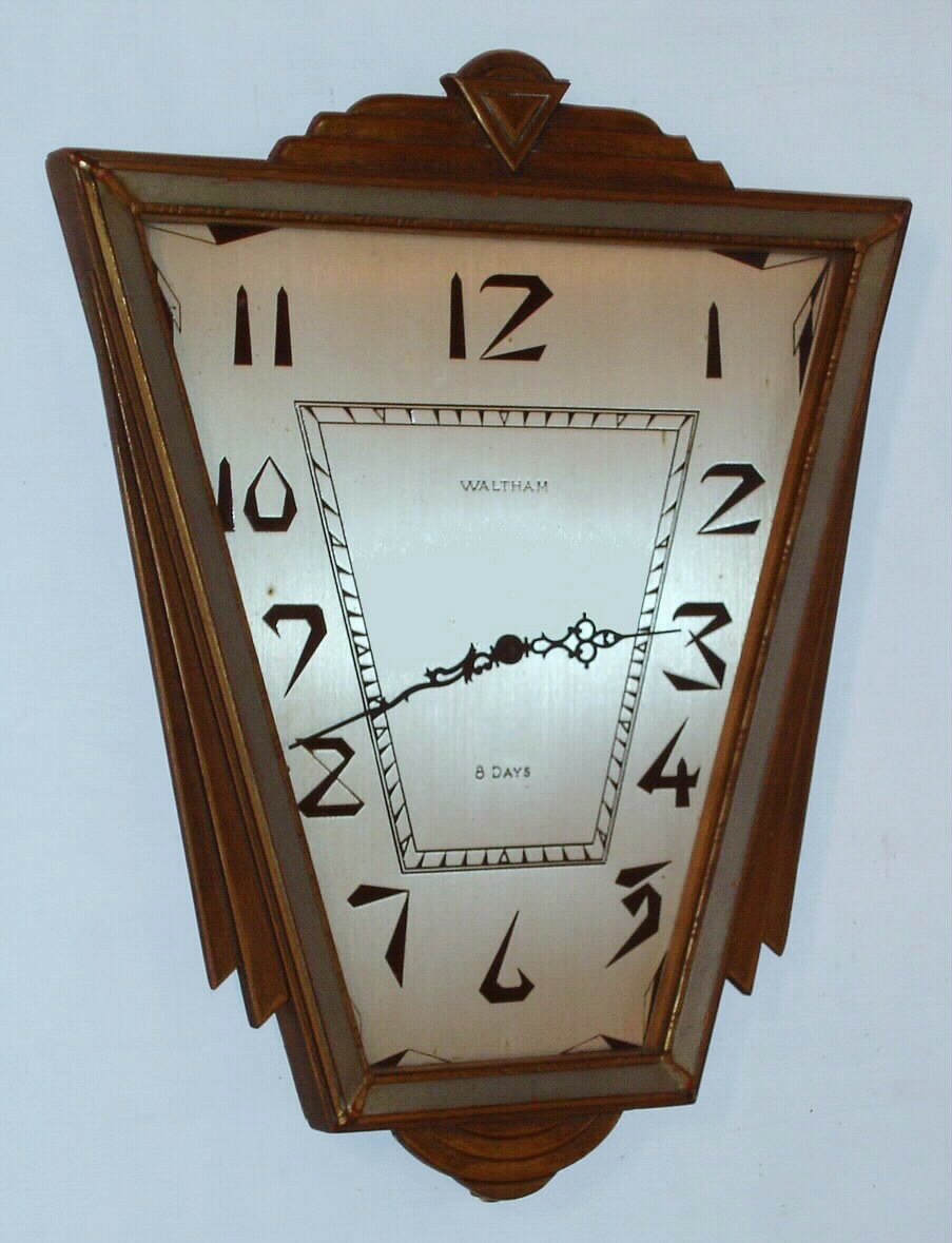 Waltham Watch and Clock Co., C. 1929 "Antique Gilt Modernistic" 8-day wall timepiece. This model was available with a 7 or 15 jewel movement. — Antique Clocks Price Guide