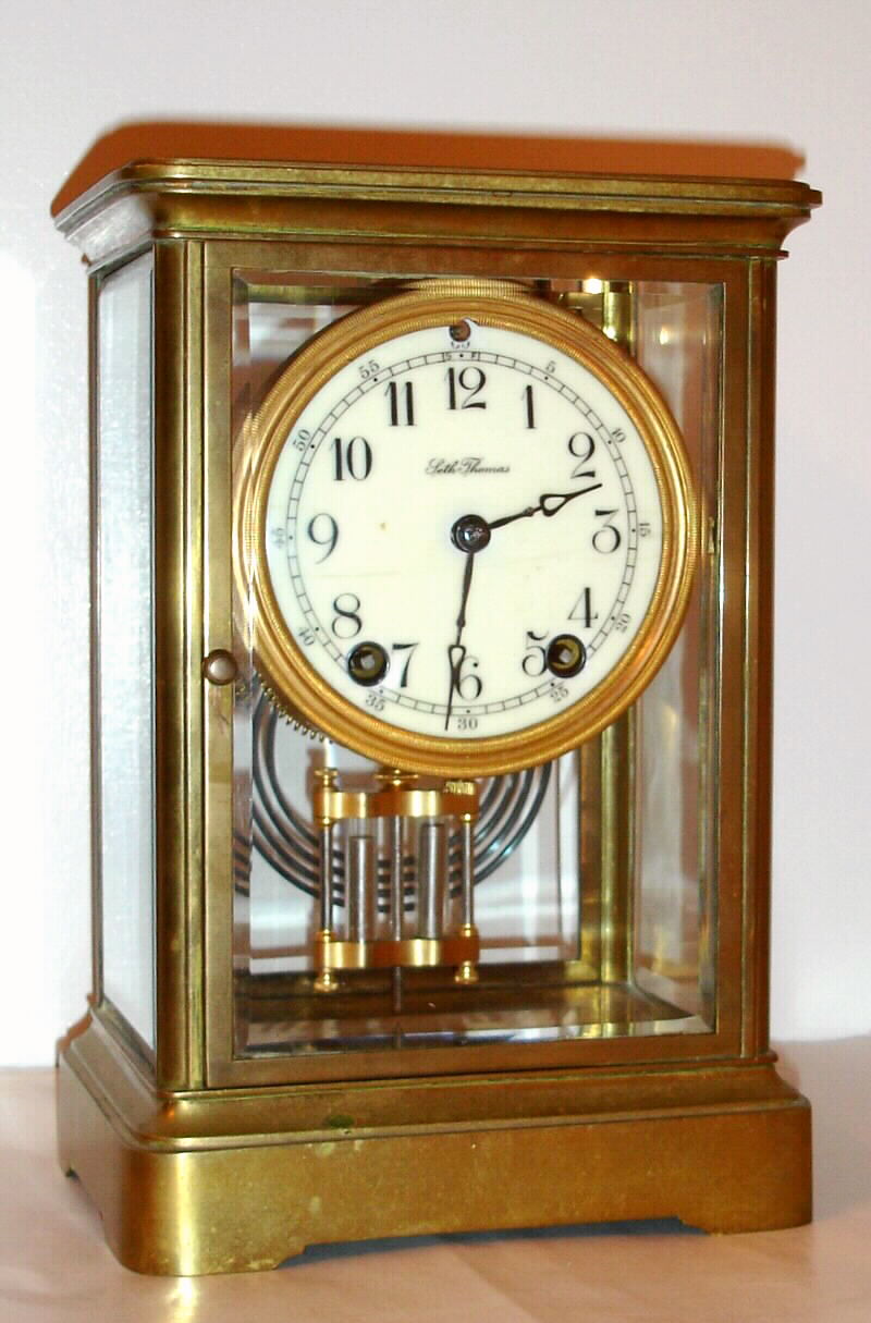 Seth Thomas Clock Co., C. 1908, "Empire No. 200", 8-day time/strike brass and glass crystal regulator mantel clock. — Antique Clocks Price Guide