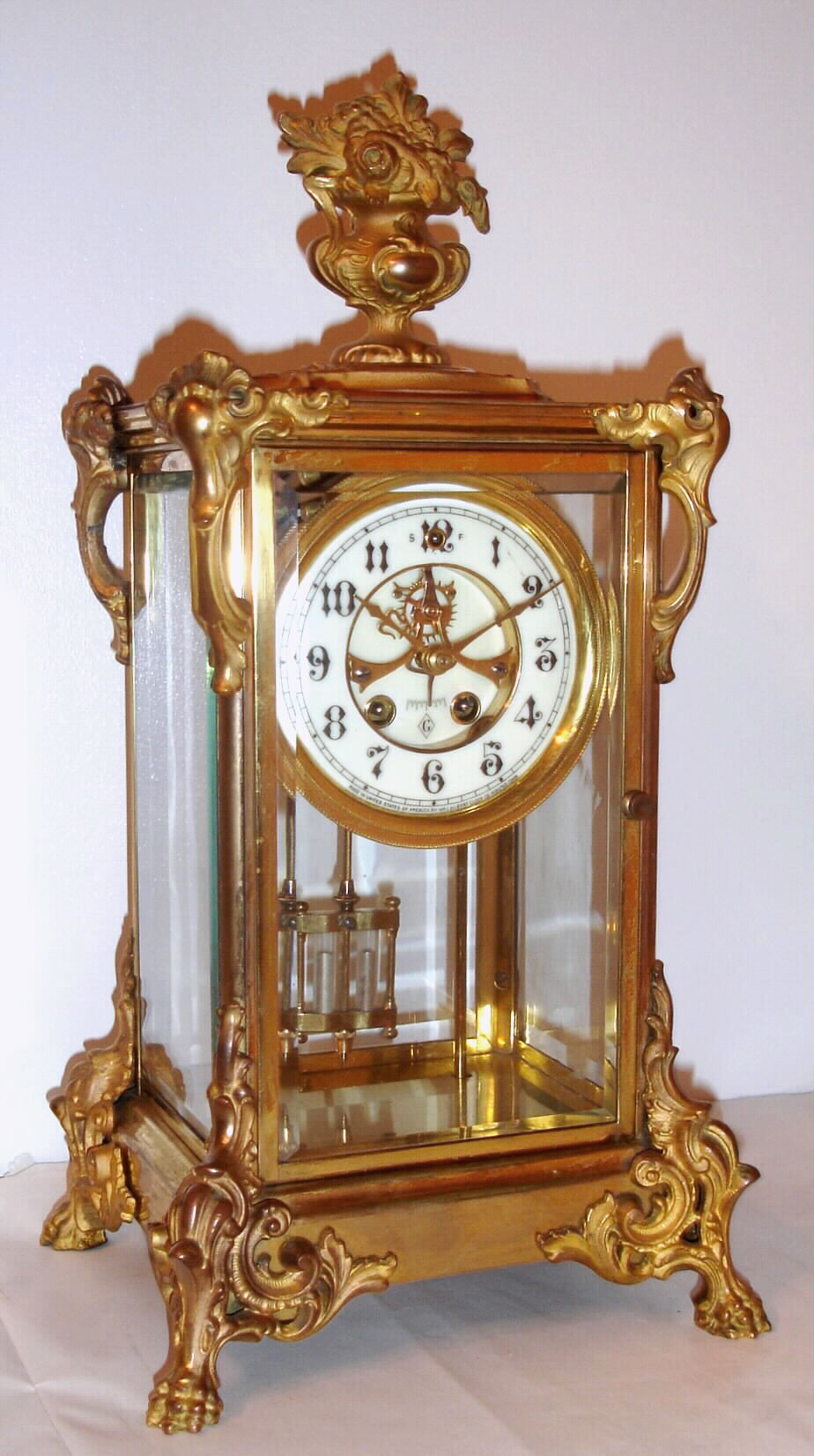 William L. Gilbert Clock Co., C.1906, "Terese", 8-day time/strike brass and glass crystal regulator. — Antique Clocks Price Guide