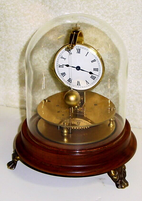 Horolovar Co., NY, C. 1975, repro of the Briggs rotary pendulum timepiece, 8-day, bottom wind with glass dome. — Antique Clocks Price Guide