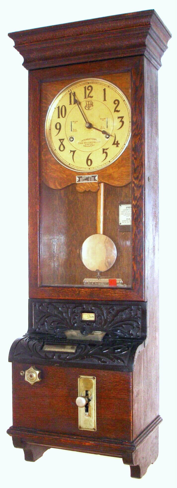 International Time Recording Co., Endicott, NY (Became IBM in 1924, punching in time clock in walnut case, c1920 — Antique Clocks Price Guide