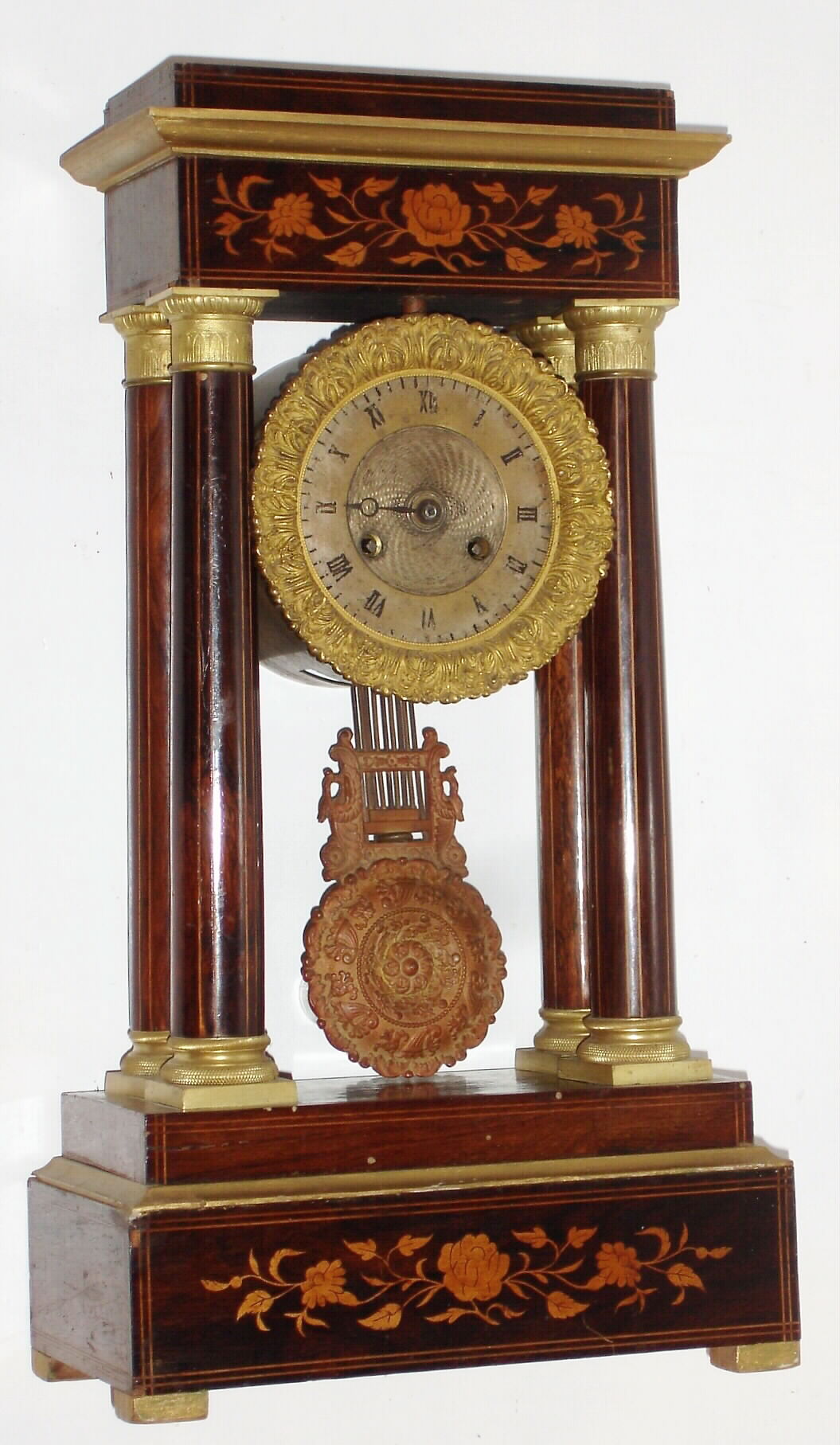 French, 8-day time/strike Empire style portico 4-column mantel clock with an inlaid case and cast pendulum, C. 1890 — Antique Clocks Price Guide
