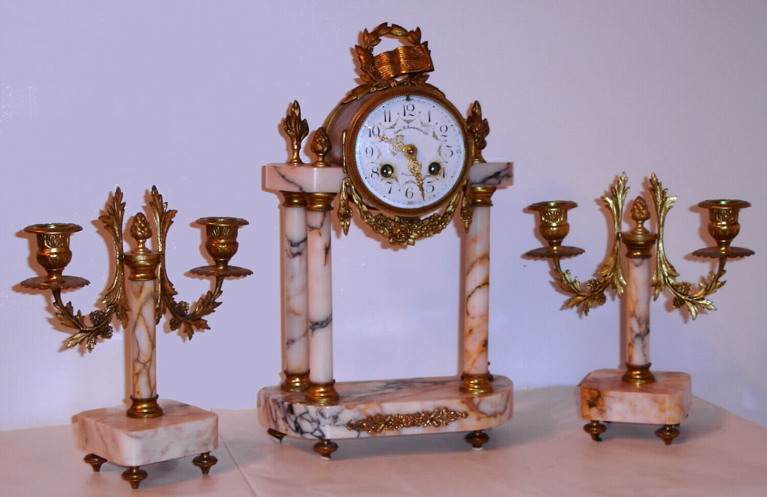 French, Marti garniture set C. 1900, 8-day time/strike mantel clock retailed by Carl. H. Anderson and Co, Stockholm with matching candelabra — Antique Clocks Price Guide