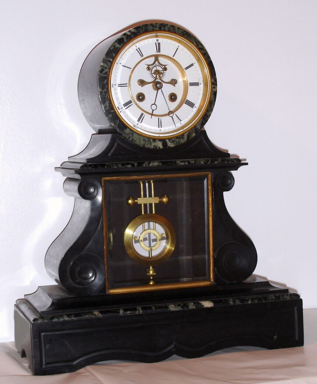 French, Marti and Cie, 8-day time/strike black with contrasting green and white marble mantel clock, with open escapement and visible Ellicott style compensating pendulum, C. 1900 — Antique Clocks Price Guide