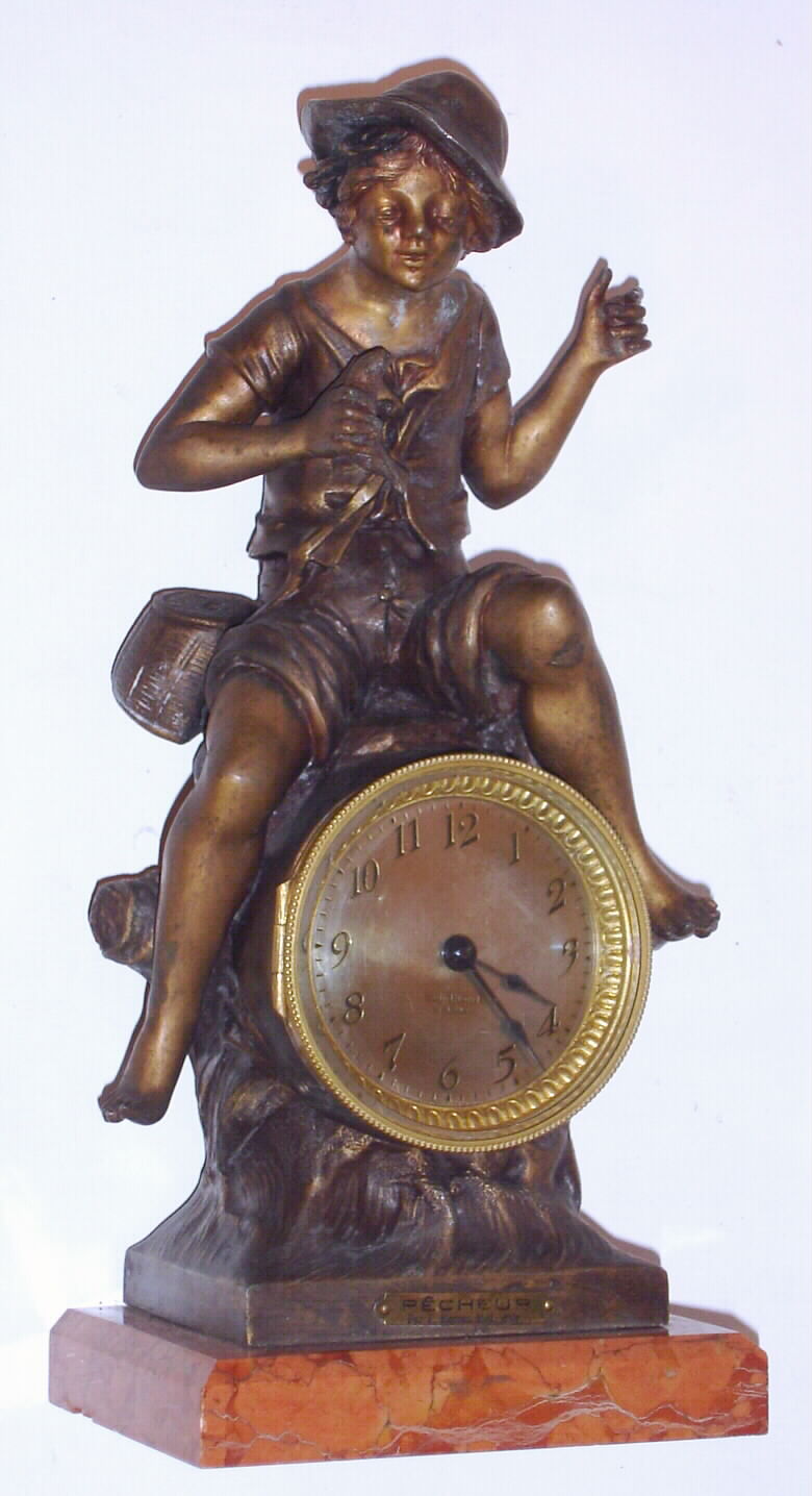 A French statue of "Pecheur, Par F. Moreau Med. d'or", now with a Seth Thomas back wind 30 hour movement married to the case. Note the boy's fishing pole is missing. — Antique Clocks Price Guide