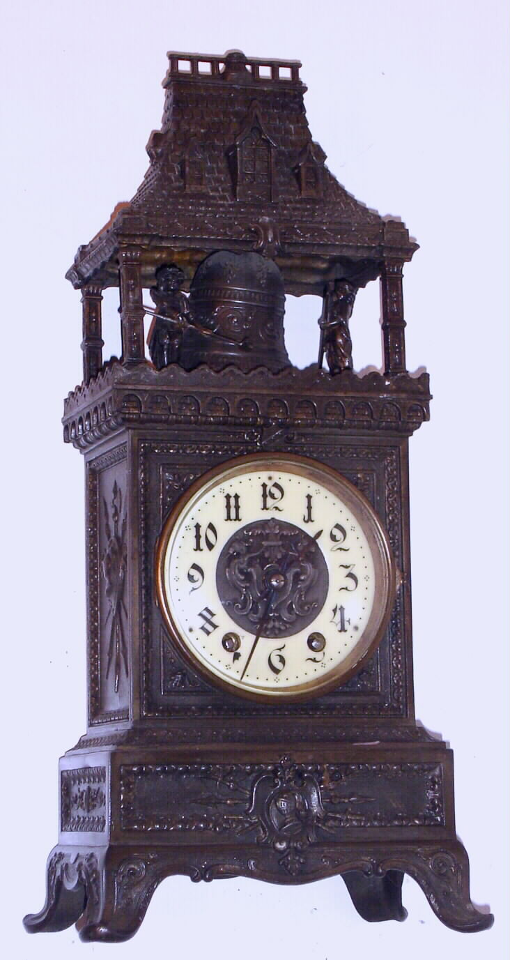 French, Marti and Cie, 8-day time/strike automaton of two figures striking a bell in the tower. The heavy case appears to be white metal with a dark finish applied. The bell ringers do not actually strike the bell as the movement strikes a wire gong to indicate the hours (it is a deep tone gong that sounds similar to a large bell), C. 1900 — Antique Clocks Price Guide