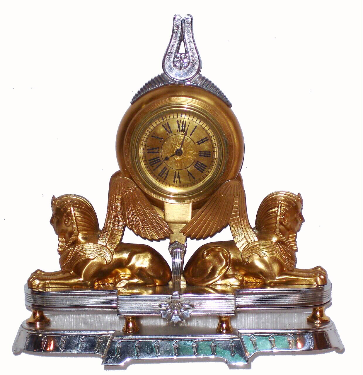 Swiss, 30-hour bar watch movement with gold balance wheel in an Art Nouveau Egyptian motif case. This was most likely a desk timepiece, C. 1920 — Antique Clocks Price Guide
