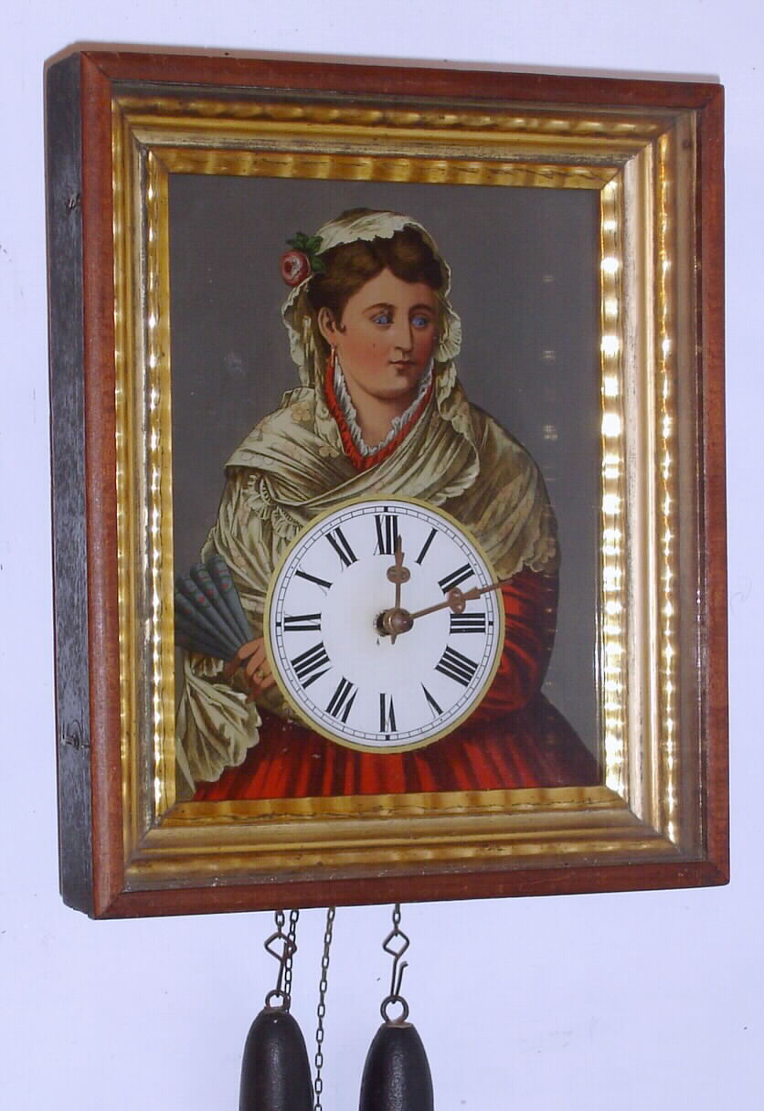 German, Black Forest, 30-hour wood and brass weight movement time/strike blinking eye picture frame wall clock; note pendulum is taped to back of case and not showing in photograph, C. 1850 — Antique Clocks Price Guide